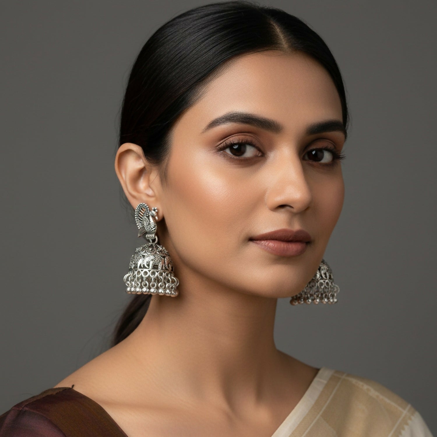Silver Peacock Jhumka Earrings – Elegant Oxidised Design - Image 2