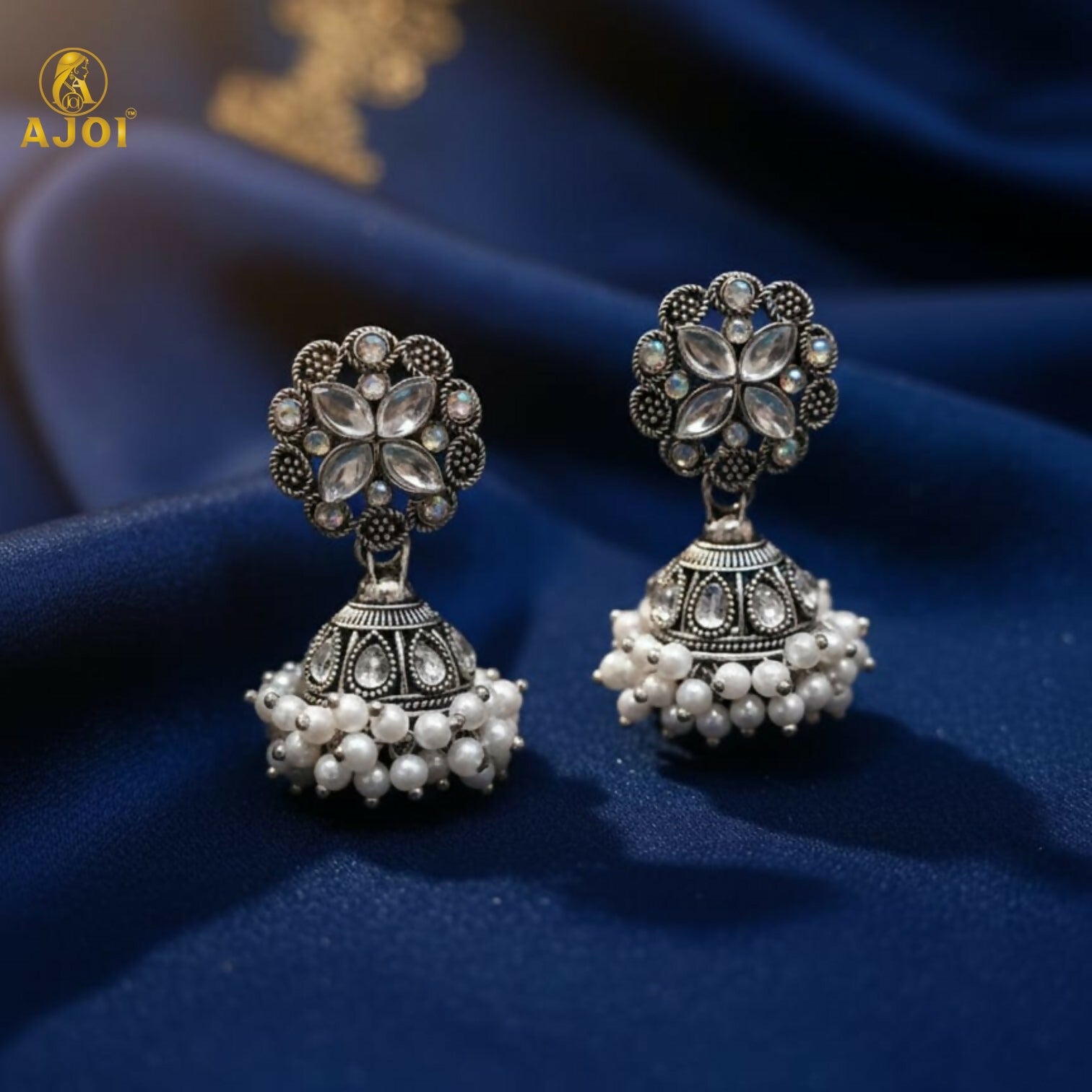 Silver Oxidized Floral Jhumka Earrings – Elegant Pearl...